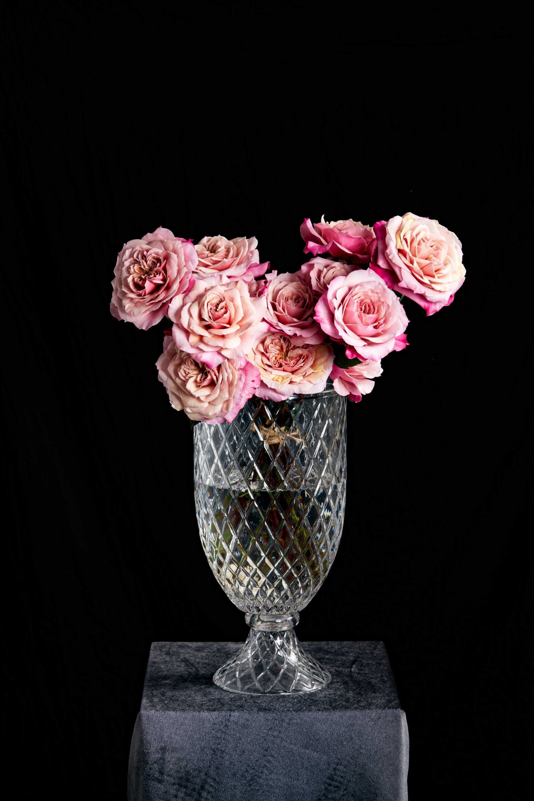 Light pink roses arrangement in a glass vase